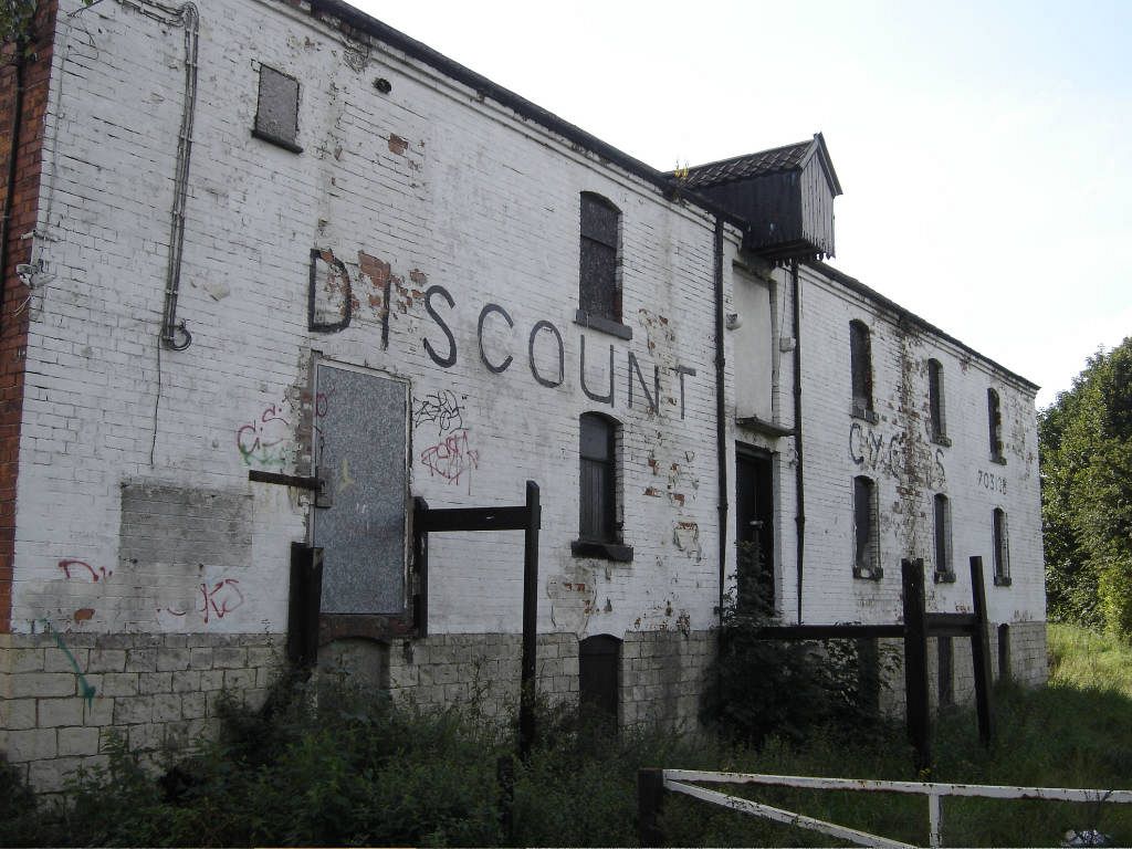Derelict canalside warehouse before refurbishment
