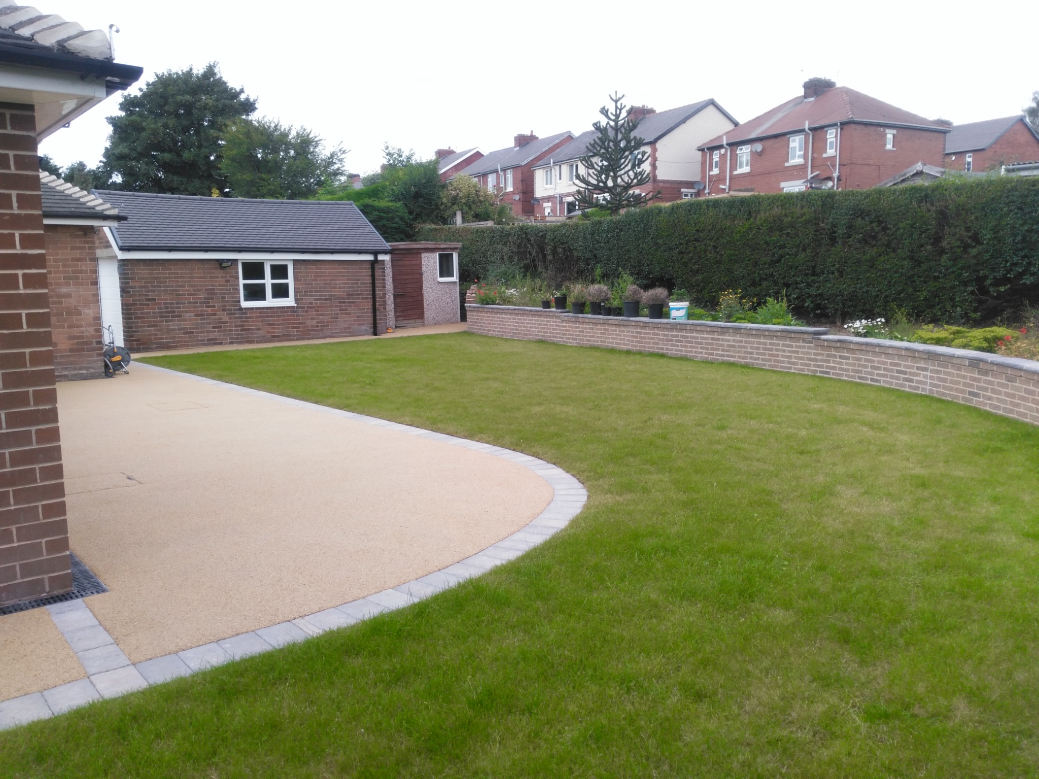 Accessible garden, level paving and outbuilding at the completed home