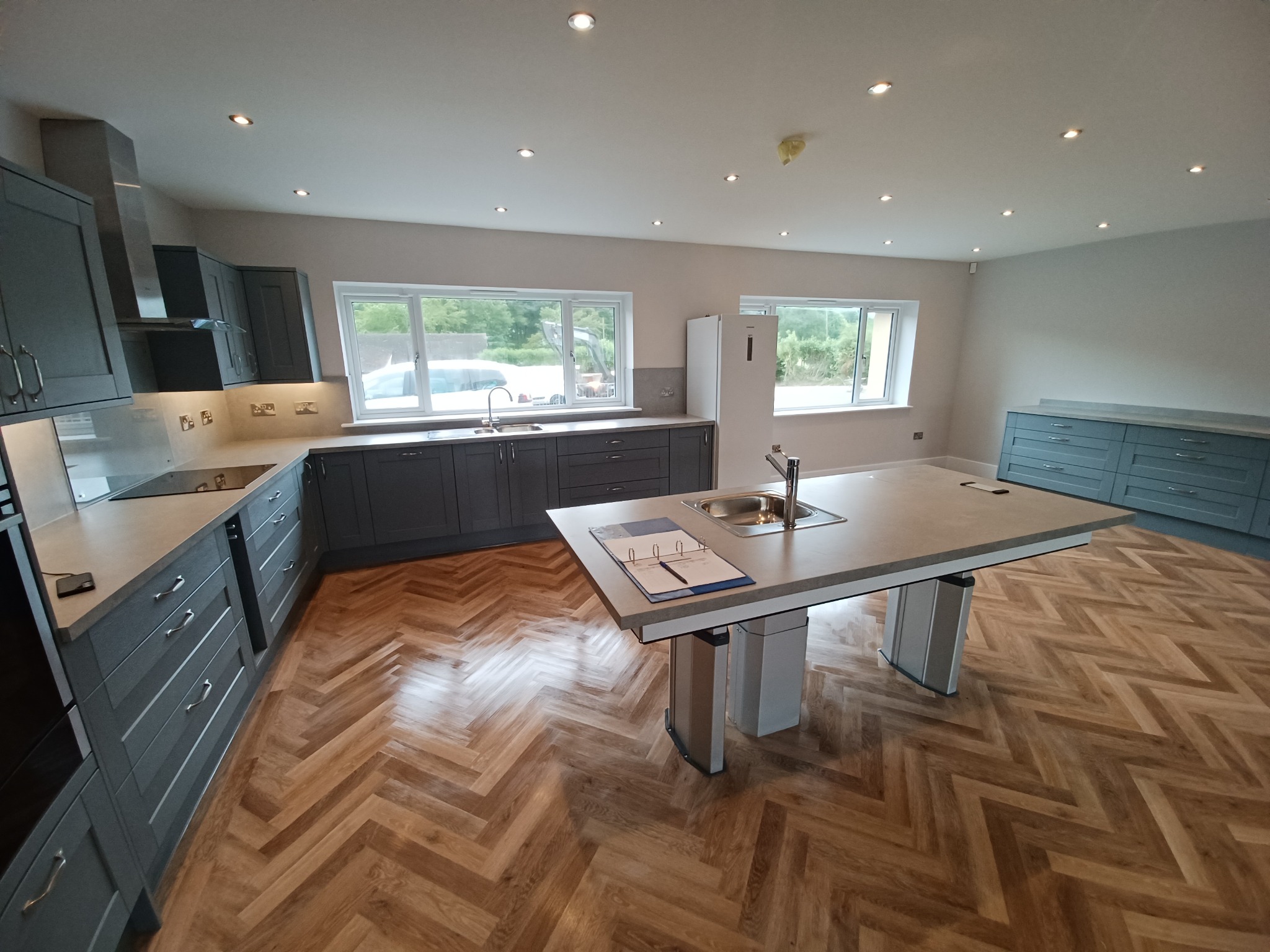 Spacious accessible kitchen with height-adjustable island