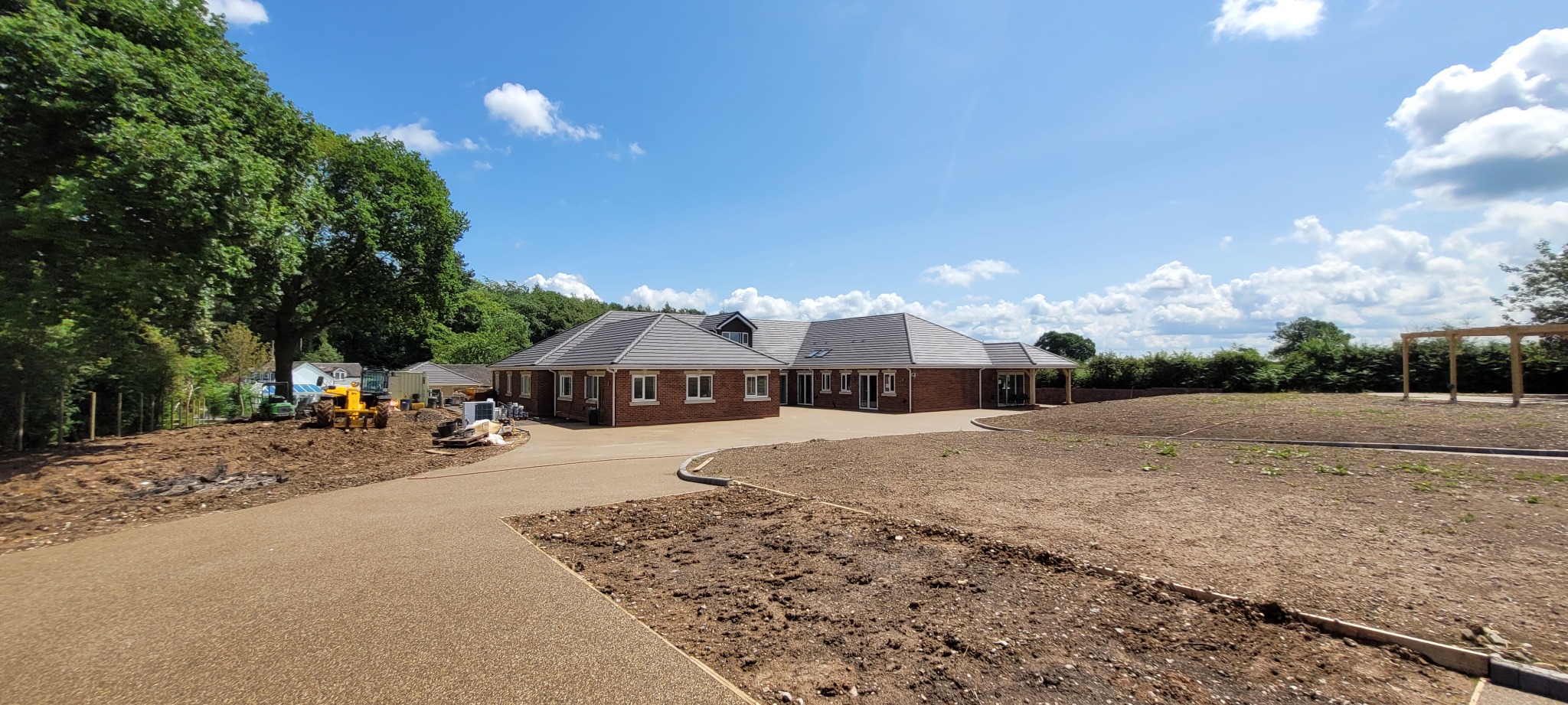 Completed accessible home and extensive landscaped grounds