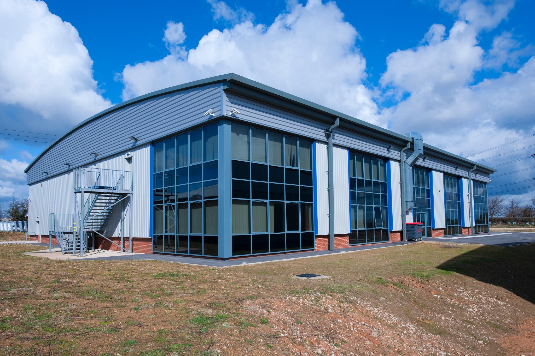 Rear elevation with glazed office bays and external stair