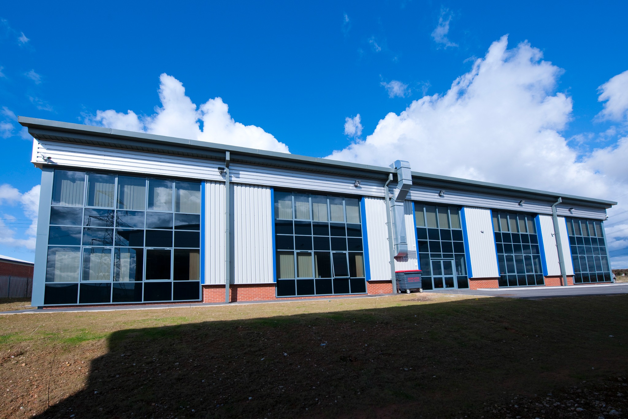 Long glazed elevation expressing the building's internal functions