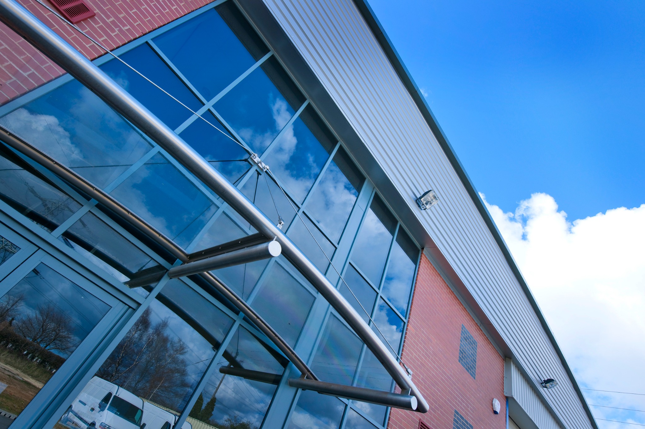 Entrance canopy and full-height curtain wall glazing
