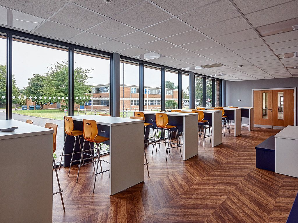 Window-side dining space at Hill House School