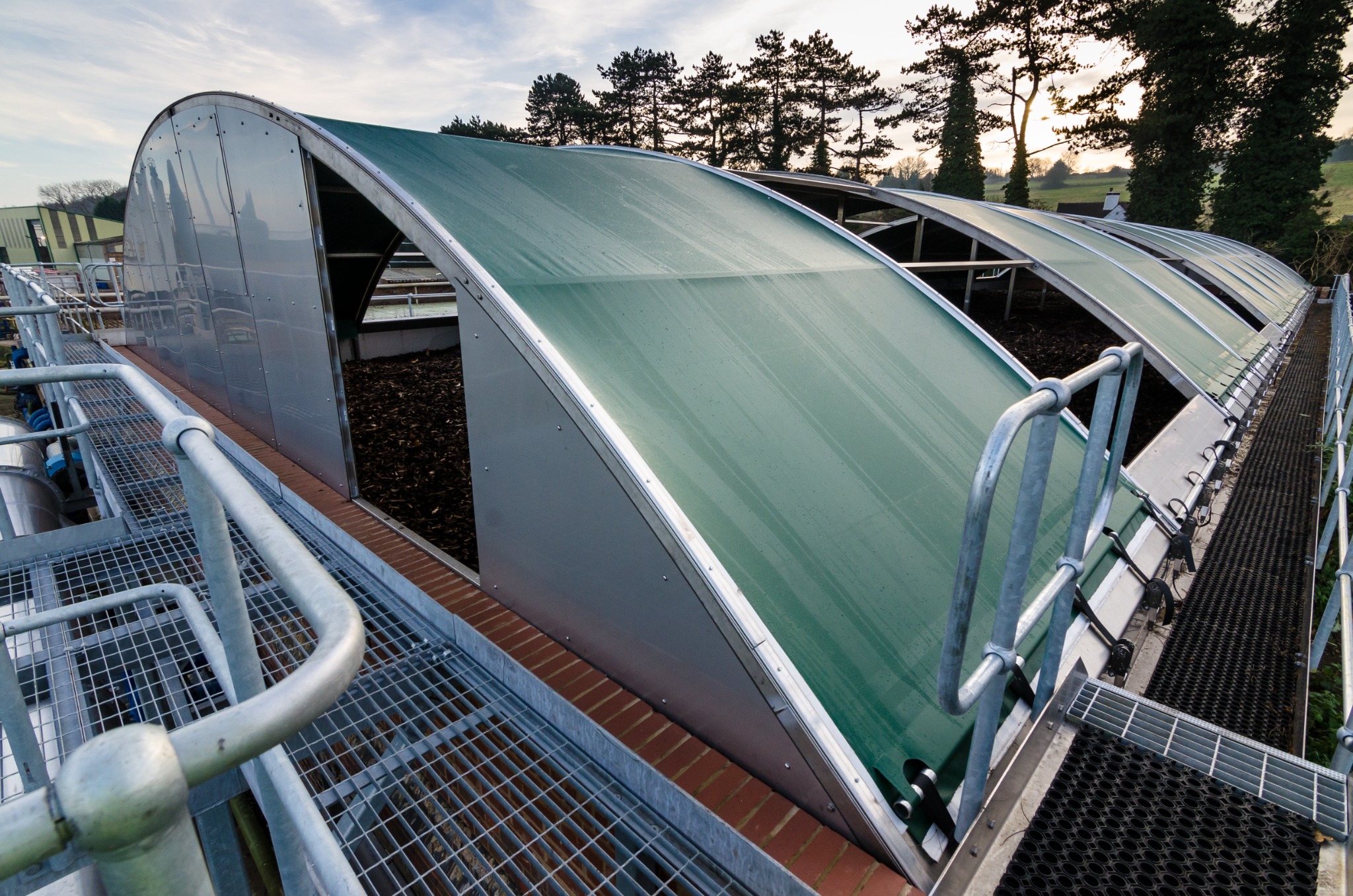 Industrial biobed facility with arched covered treatment beds