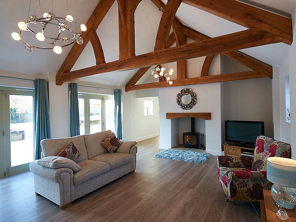 Living space with exposed timber roof trusses