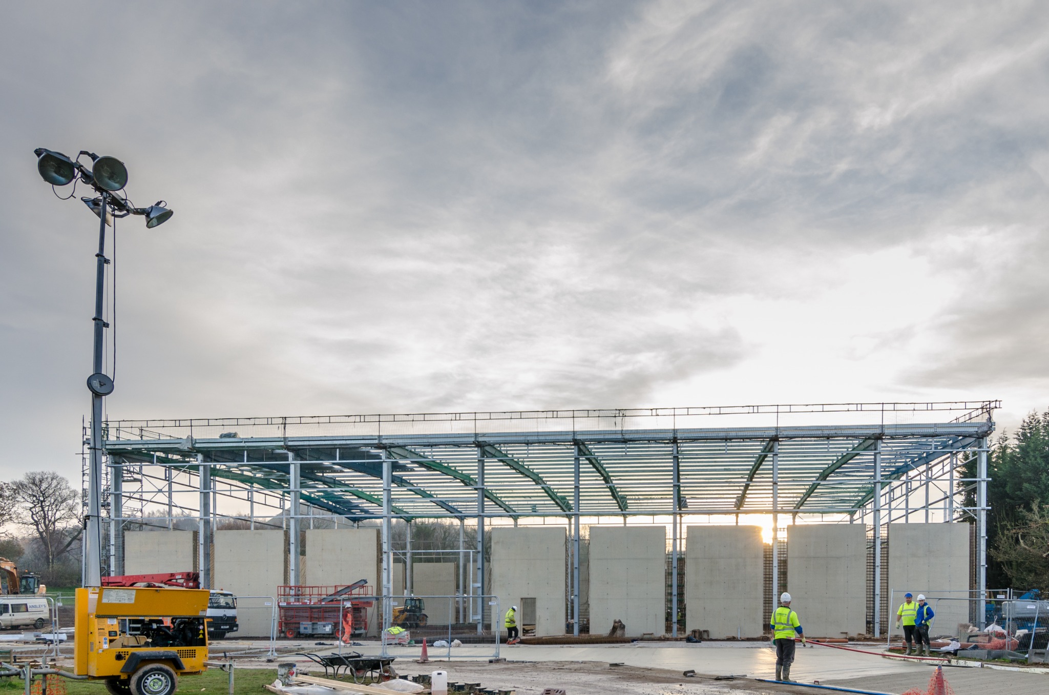 Steel frame and concrete wall construction during delivery