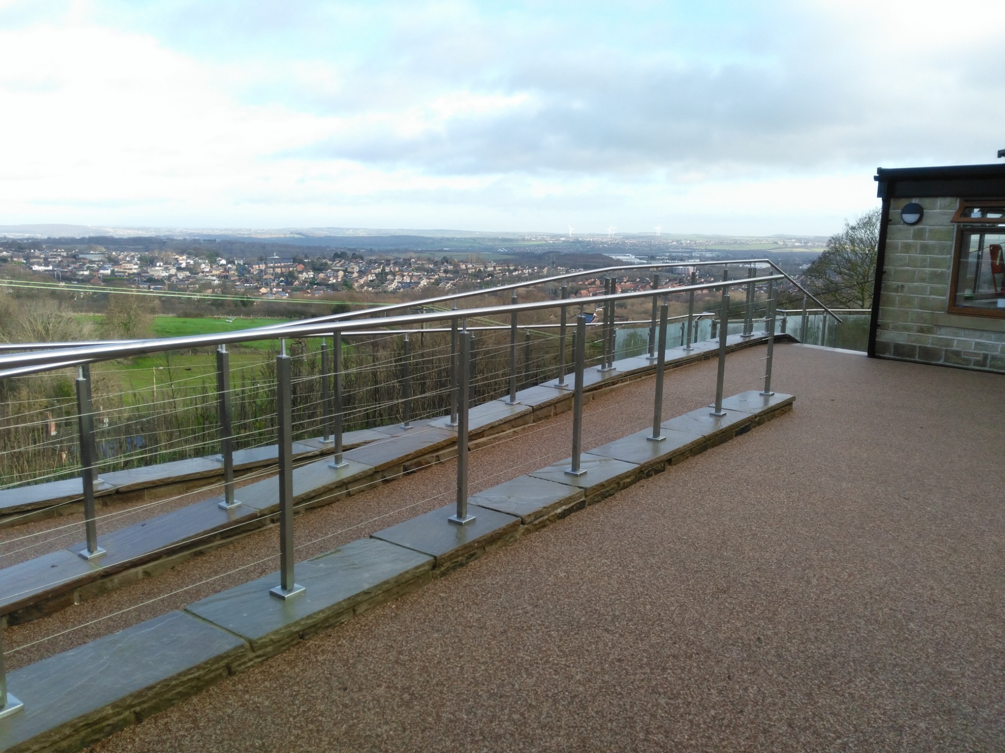 Level-access patio and balustraded route overlooking the Sheffield landscape