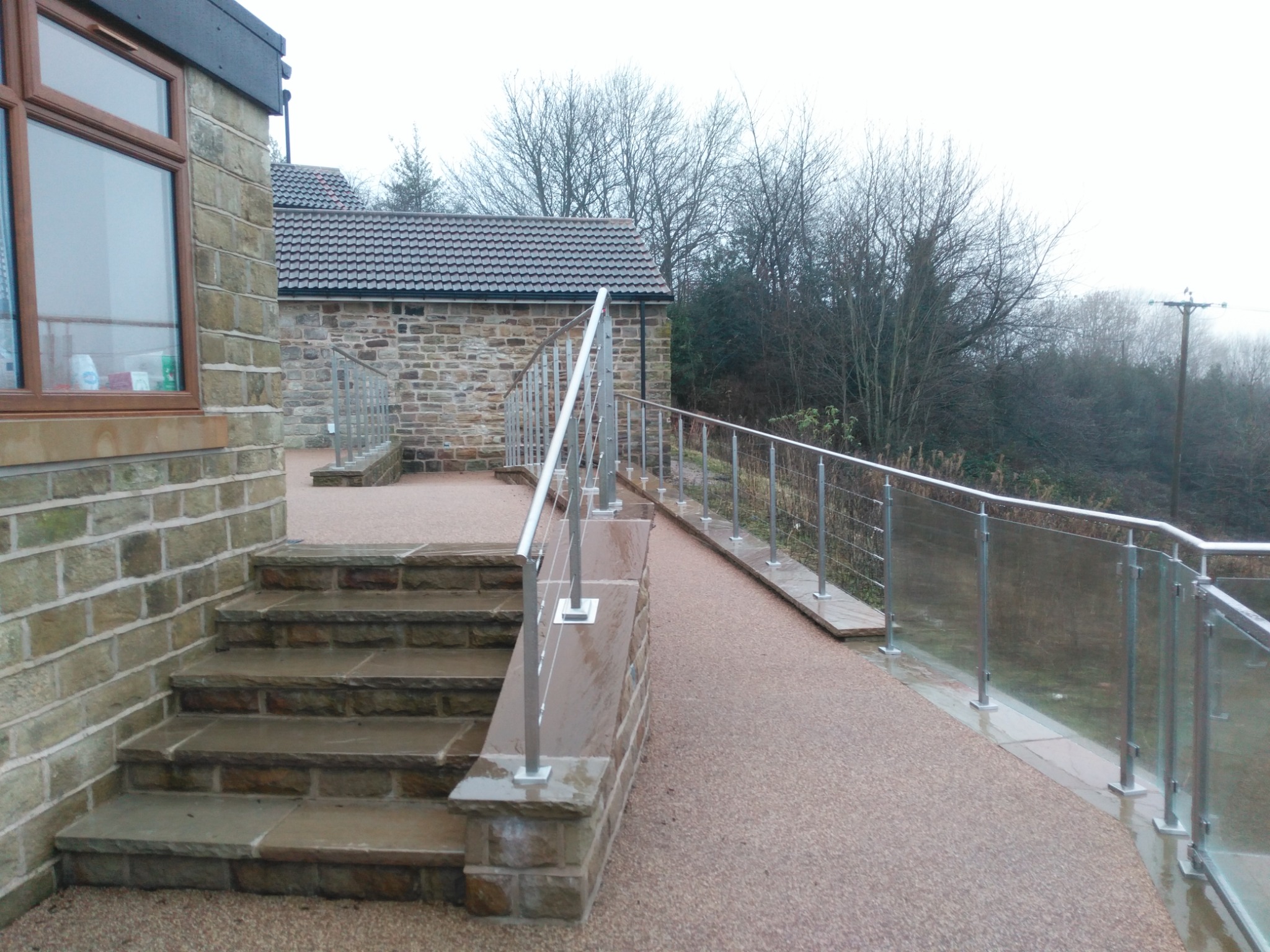 Accessible stepped and ramped routes around the hillside site