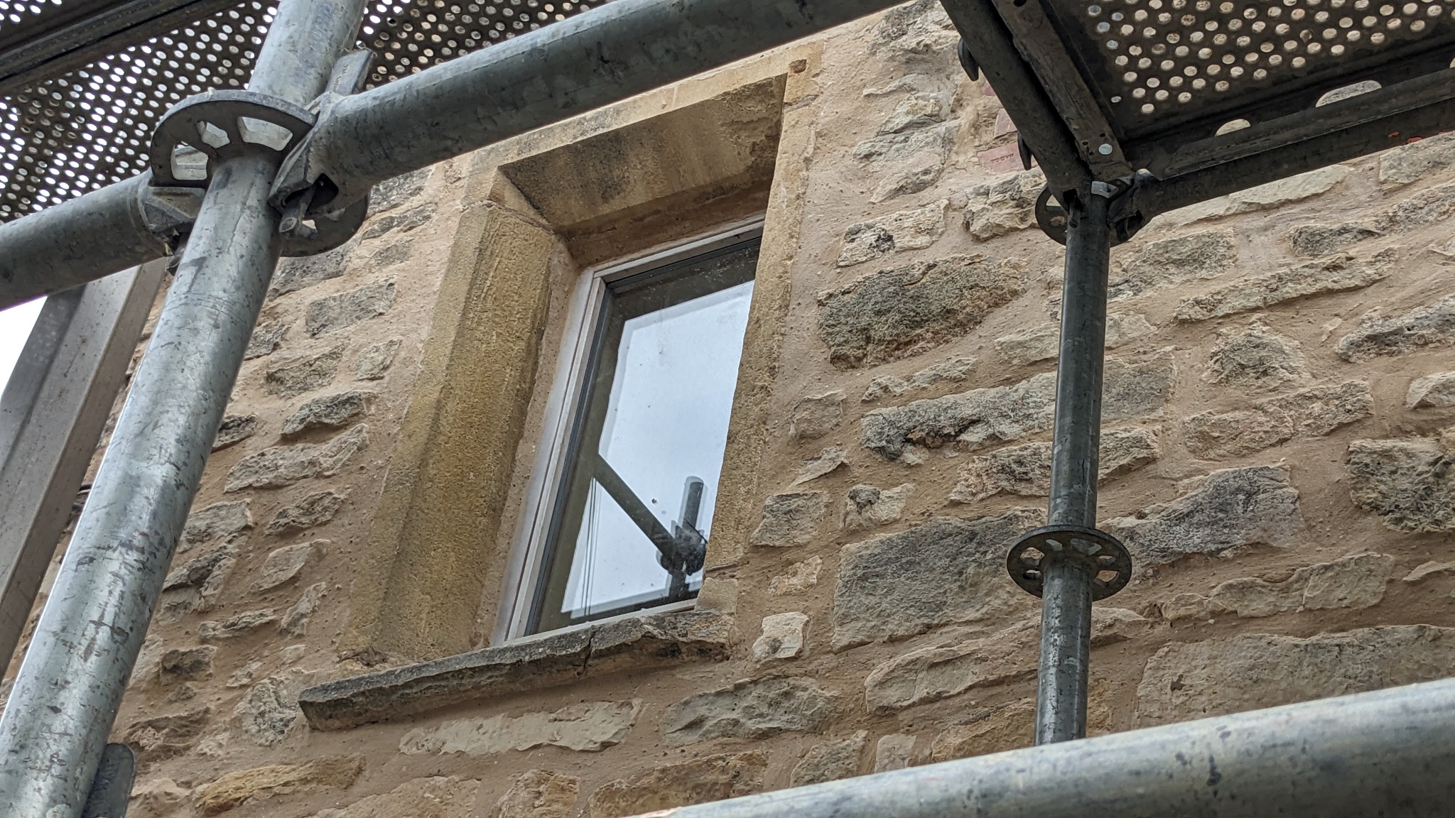 Traditional stone window surround during conservation repairs